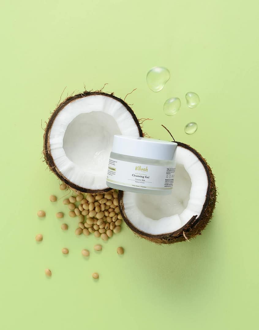 jar of cream on coconuts halves